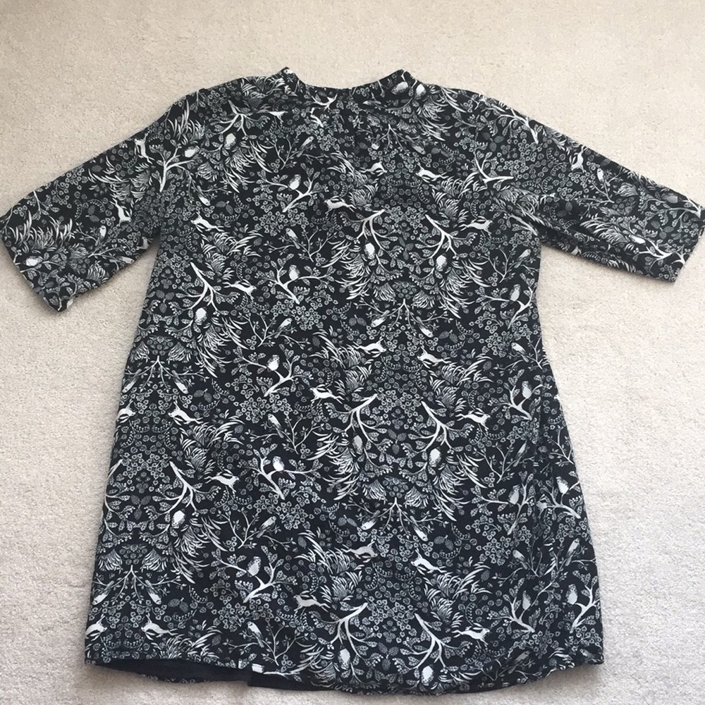 Black dress with white tree and animal accents